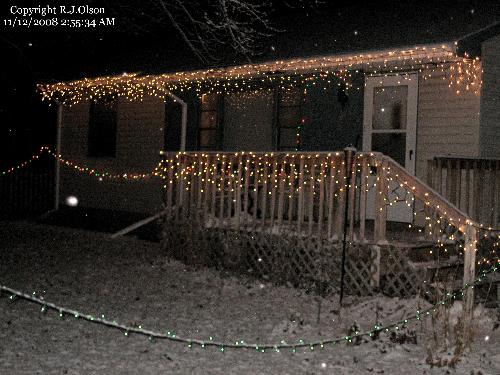 My House - Christmas lights lit up and a fres snow fall happening as well.