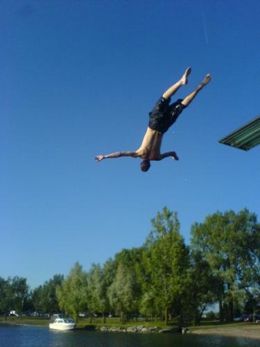 my son - doing a back flip ... hes a stunt man ...