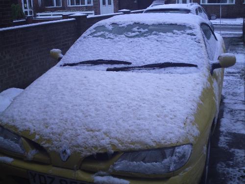 my yellow car - had a snow this morning, so it covered with snow.