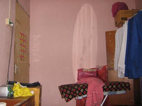 Entity Photo 01 - Photo of an entity caught on digital camera. There was nothing on the wall. The image did not show up on the LCD screen while the photo was taken.