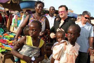 Bono in Africa - A snapshot of Bono spending some time with African people.