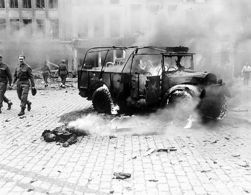 world war 2 - this boys dead burning body shows damage done by V-2 on a main intersection antiwerp, on a main supply line to Holland