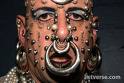 Excessive Facial Piercing - What is the reason for this? Is he trying to hide, or make a statement?