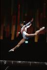 Gymnastics - This is a picture of a girl doing gymnastics. She is leaping through the air.