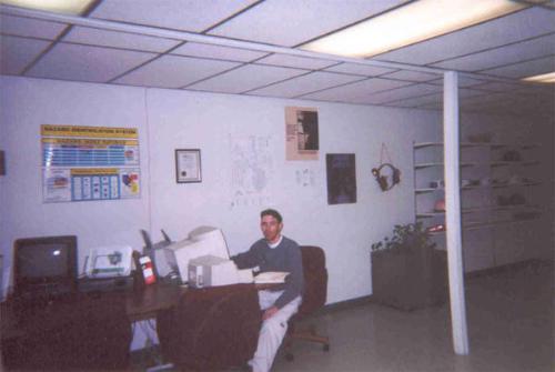 Hard at work - This is a picture that one of my friends snapped of me while I was 'pretending' to do payroll one afternoon. I was actually looking up airfare and tickets to a KC Chiefs game.
