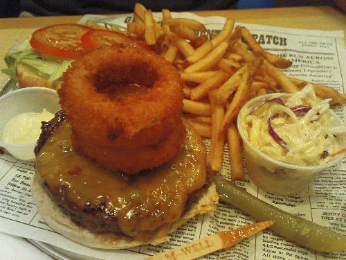 Two big onion rings on a burger - Had this at bubba gump..  their portions are huge! :) Not that I'm complaining :p