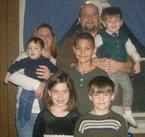 Holiday Family Photo - My family in front of our tree that you can't see.