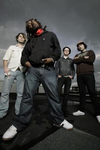 Skindred - Benji Webbe, Daniel Pugsley, Mikey Dee, and Dirty Arya are the members of the band Skindred. Together they form a great blend of music and the final product sounds amazing. A perfect mixture of metal, rock, and reggae. Check them out.