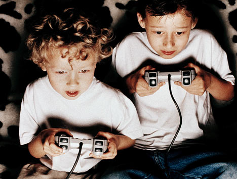 kids playing video game - two kids playing video game.