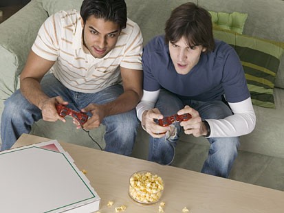 playing video game - brothers playing a video game.