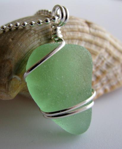 Seafoam Green Sea Glass Necklace - A lovely shade of seafoam green sea glass is wrapped with sterling silver wire and hangs on an 18' sterling silver ball-style chain. This gorgeous, flawless piece of seaglass is approx 7/8' in length and was found on north shore of Puerto Rico.