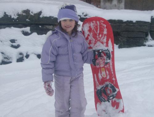 My daughter with a snowboard - My daughter with her snowboard after going down the hill on it. This was her first year using a snowboard, and she did pretty well with it. My daughter with a snowboard - My daughter with her snowboard after going down the hill on it. This was her first year using a snowboard, and she did pretty well with it.
