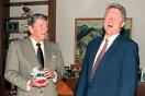 Bill Clinton and Roaland Regan - Giving and award to each other Bill Clinton and Roaland Regan - Giving and award to each other