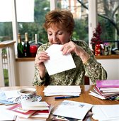 Woman doing Christmas Cards - photo of woman working on her Christmas cards