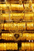 gold - photo of gold bracelets and necklace in shop