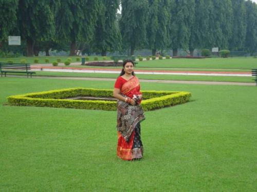 in sweet red.. - in a garden..