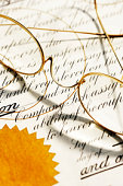 legal document - photo of Glasses on legal document, close-up