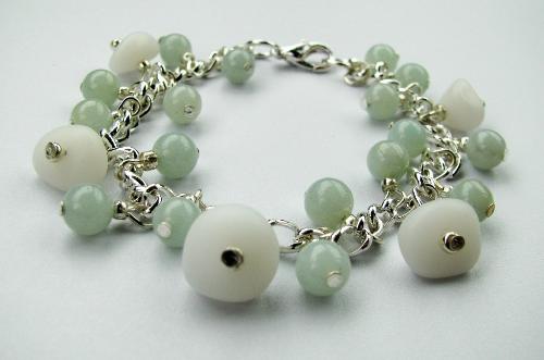 Opaque Sea Glass Bracelet - Not sure what I'll call this one. This bracelet contains 5 beautiful opaque white sea glass (also known as milk glass) It is accented with soft pale blue/green amazonite beads. The bracelet measures 7 1/2' in length.