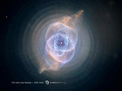 The Cat's Eye Nebula - A picture of a dying star and the clouds of gas eminating from it. This one is the Cat's Eye Nebula taken by the Hubble Space Telescope.