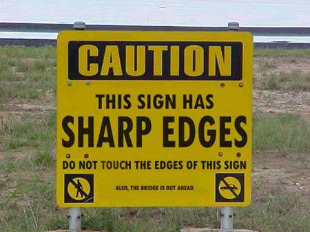 This Sign Has Sharp Edges - Be careful not to touch the edges of this sign, for they are very sharp and could cut you.