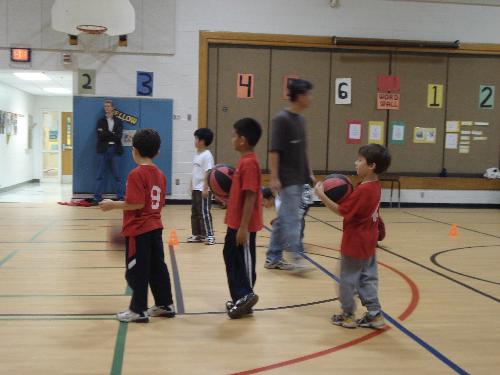 During basketball practice - Getting ready to shoot hoops.