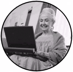 Grandma on Computer - This is a picture of a grandma on the computer. This is in the public domain. 