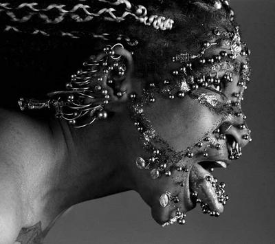 Piercings - She is the Most pierced woman. And holds the Guinness record for it. I love this pic of her