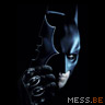 The Dark Knight - Batman's head showing in a dark frame, and holding a weapon if his called a 'Batarang' in ready position.