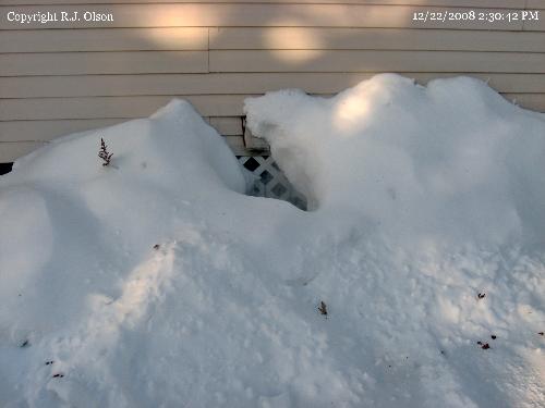 Snow piled high - A shot taken from the side of my house. Snow piled high - A shot taken from the side of my house.