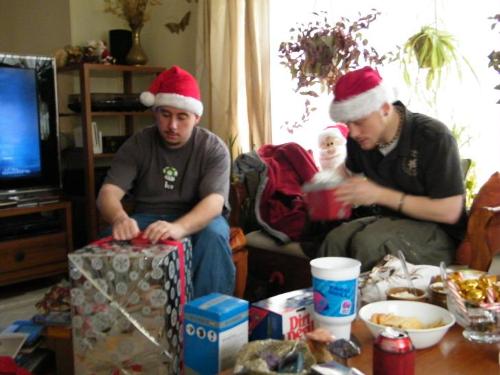 My Sons Xmas 2008 - This is a photo taking yesterday, 12/24/08, of my sons opening gifts. We celebrated Christmas yesterday because my oldest son has to work tonight and would have had to leave early, so we celebrated on Christmas Eve. It was lovely!!!
