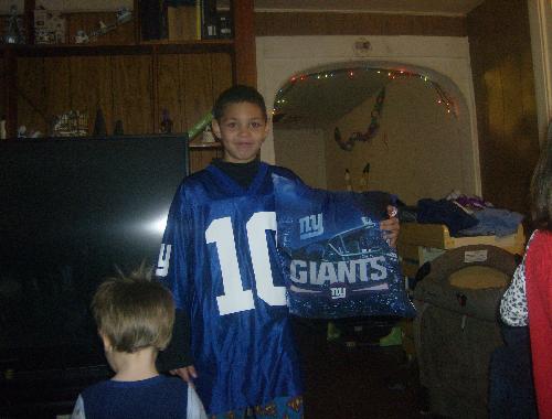 My oldest son - These are gifts we bought him, he's very pleased with them, he's a huge football fan and loves the Giants. At least Santa didn't disappoint him this year!!