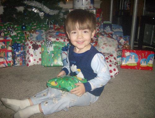 Cutest Pose - My toddler posing with his first gift this Christmas. Isn't he adorable? Cutest Pose - My toddler posing with his first gift this Christmas. Isn't he adorable?