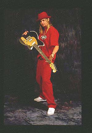 Kid Rock - Kid Rock poses with one of his favorite guitars