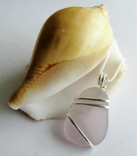 Lavender Mist Sea Glass Necklace - A flawless and rare piece of lavender sea glass is wrapped in sterling silver wire and hangs on a 18' sterling silver chain. Very feminine and beautiful!