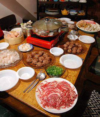 Steamboat - Traditional steamboat dinner with all kinds of ingredients cooked in a rich chicken stock.