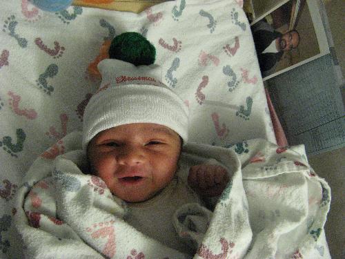 Smiling on Second Day On Earth ! - My grand son,Nithin was born in OSF hospital in Peoria,IL,U.S.on 7th Dec 2009.

I took the picture on 8 th December ,the next day.

I could not believe my eyes,I was ver happy to see a smiling baby!

See yourself the smiling baby!

Be free to write your comments!

Happy new year