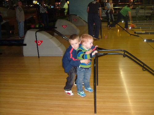 My son on his 8th birthday bowling with his little - My two youngest sons bowling
