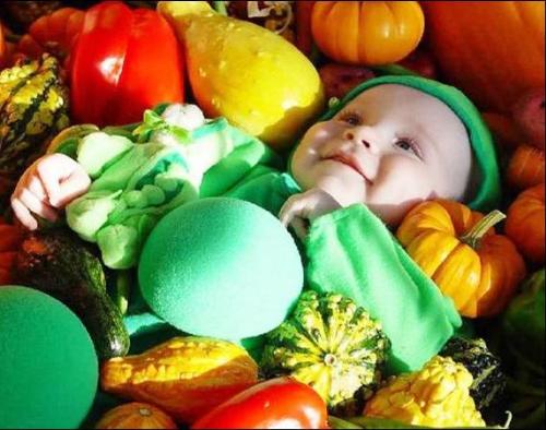 Baby in fruits - Healthy living starts with good eating. She starts a a baby.