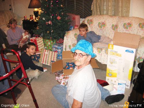 Nice Hat? - My son could not rersist taking this shot in my fancy furry hat on Christmas Eve as we opened gifts