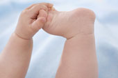 Baby - Picture of a baby playing with his toes