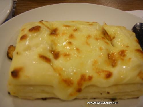 Seafood Lasagna - Layered pasta with tasty seafood mix of prawns , scallop , squid , fish and onion in creamy, mornay sauce