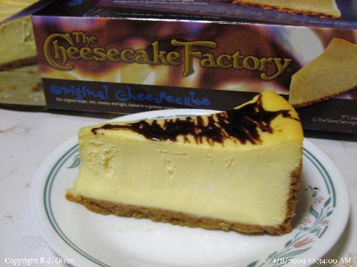 yummy! - New York style cheesecake with Hersheys Chocolate dribbled on top.