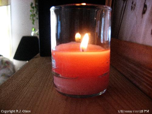 Votive Candle and holder - One of many I burn daily.