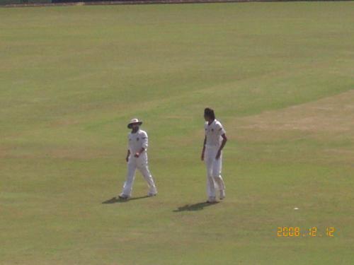 ishant sharma and sachin. - here sachin is having a word with ishant sharma before he starts his run up....