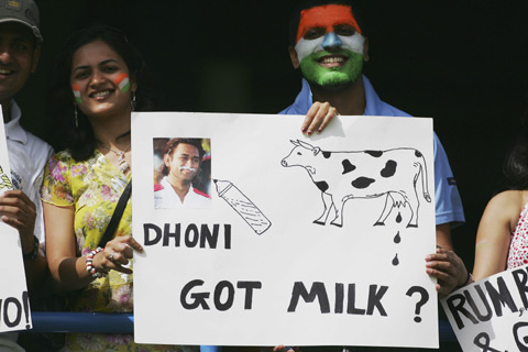 a fan showing a banner - a fan shows a banner making fun of dhoni...