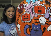 me and my giant pumpkin - huge papier-mâché pumpkin that i painted. hahaha