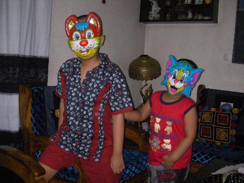 Two joyful kids with masks. - Two happy kids.They wear masks and making fun.Childhood is so joyful.