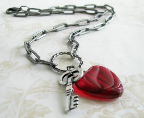 Key to My Heart Bracelet - A antiqued long-link silver bracelet is adorned with a Red Glass Heart and antiqued silver key pendant. The pendant hangs on a burnished silver ring.  A Great Valentine's day accessory!!