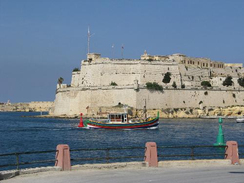 Grand Harbour in Valletta - Malta - This is just a simple photo of some activity happening in the Great Grand Harbour of Valetta, Malta. A Port shaped like a hand, each entry is a ship warf or yard.