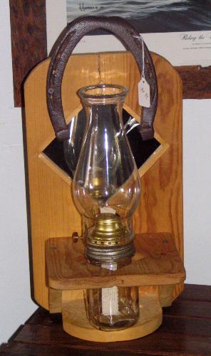 Country oil lamp with horse shoe hanger - Keeping with a rustic theme oil lamps like this are very easy to make and are a wonderful addition to any room. I sell these and many other handmade items in my ebay store at: www.stores.ebay.com/oleandlenasofwisconsin